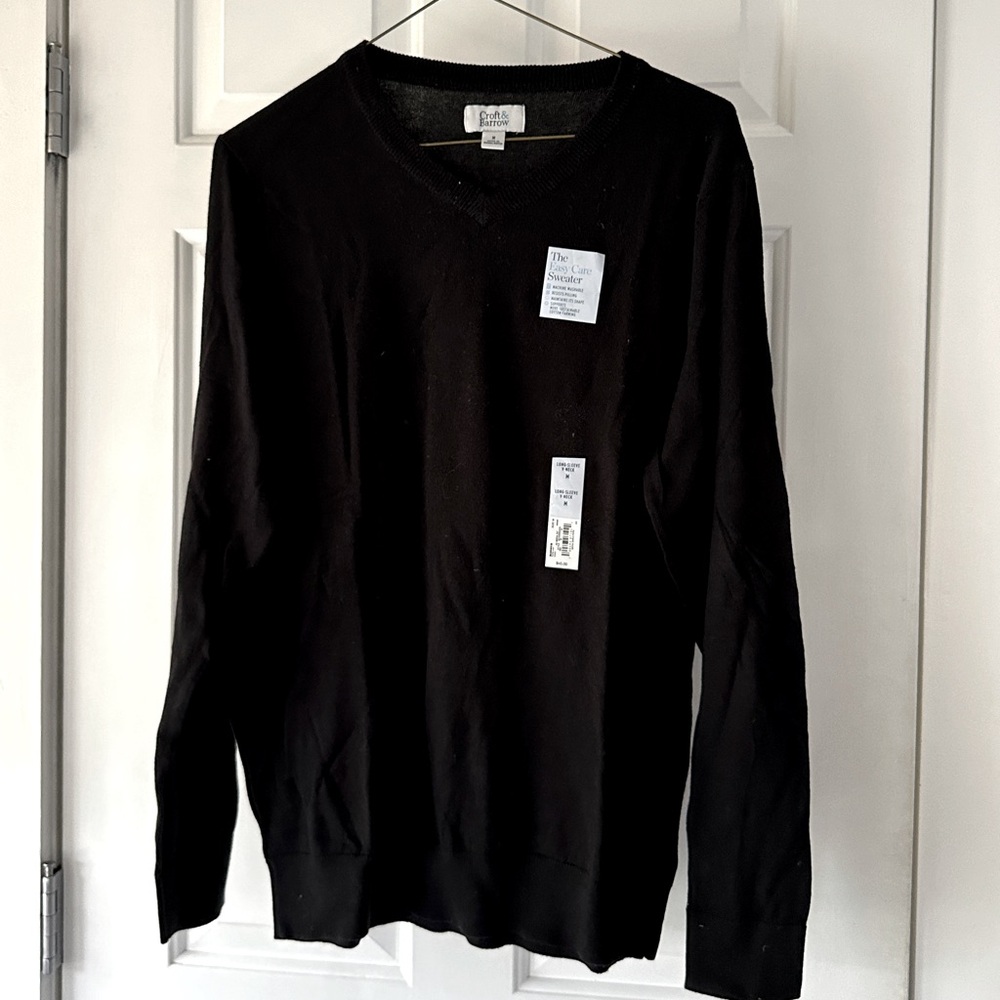 New with tags black V-neck sweater great purchase!